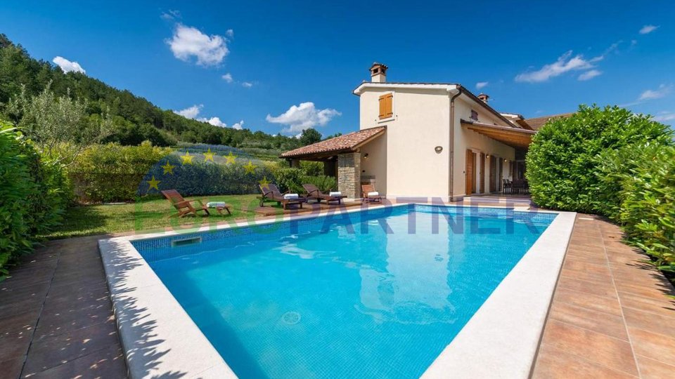 A detached villa with a pool in a magical setting surrounded by greenery
