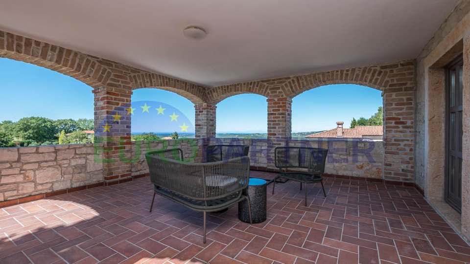 Coexistence of nature and architecture, Stone house with a view of the sea